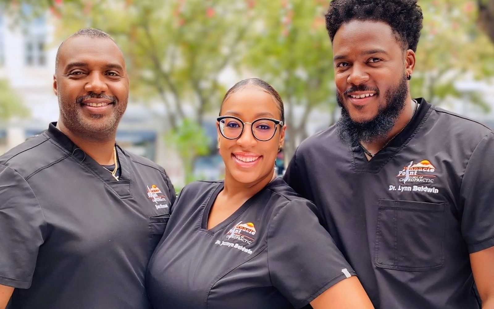 Dr. Lynn Baldwin, Dr. Jazmyn Baldwin and Joe Brown outside their Grand Prairie clinic