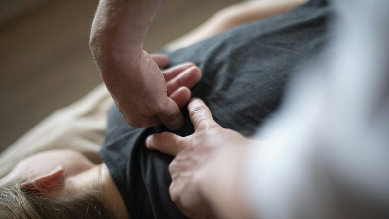 Chiropractor performing a spinal adjustment